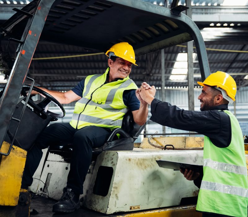 Industrious Engineer Operating Forklift in Warehouse. Efficient Forklift Driving in Factory.