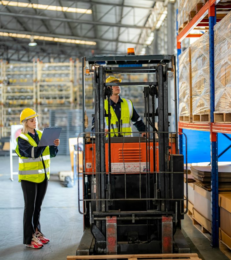 Warehouse worker operating a forklift Warehouse worker operating a forklift