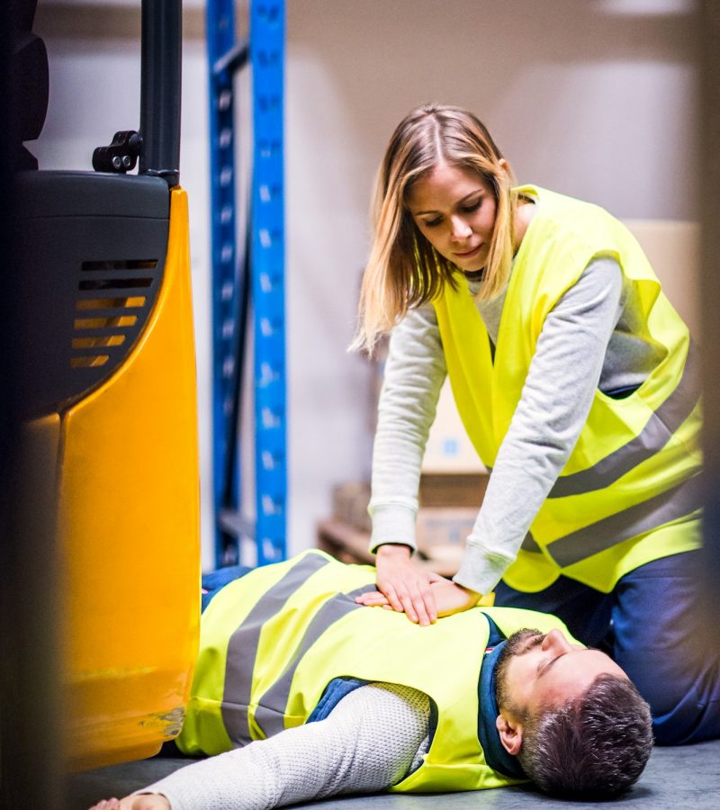 Warehouse workers after an accident in a warehouse. Warehouse workers after an accident in a warehouse.